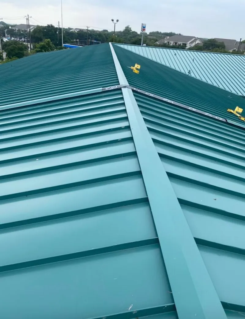 Green commercial metal roof ridge and valley for Metal Roof Repair in Brownsville